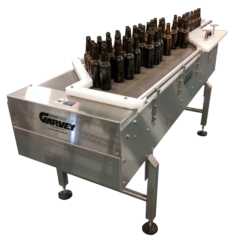 Garvey Bi-Flow machine with glass bottles on the conveyor belt.